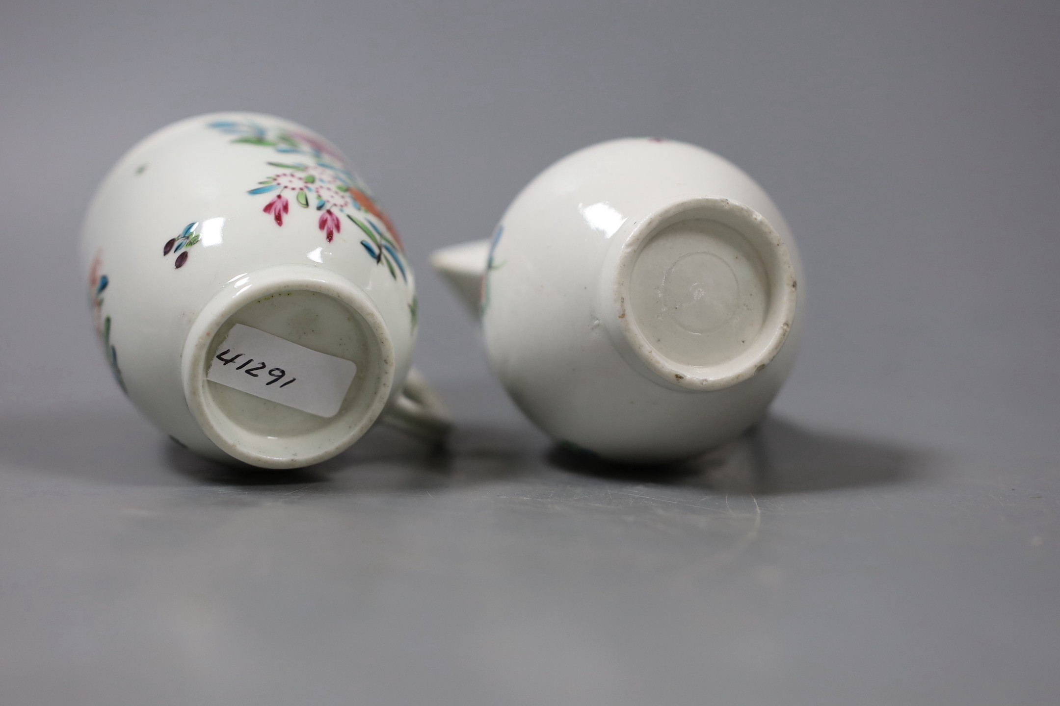 A Worcester sparrow beak jug, enamelled with flowers with an inner underglaze blue border and a similar coffee cup with a line loop and dot border. Tallest 9cm